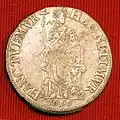 Back of 1696 Leeuwarden silver half 3 guilder coin, with the Latin inscription "HANC TUEMUR, HAC NITIMUR" ("We protect her; she supports us").[8]