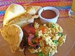 Fry jacks are Belizean deep-fried dough pieces served for breakfast, and can be shaped as circles or triangles.