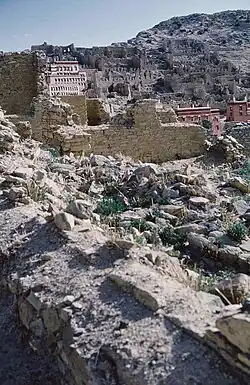 1985 photo of a portion of Ganden Monastery ruins (with some new buildings) destroyed by the People's Liberation Army in 1959, after Tibetan's March 10th Lhasa protest and the flight to exile of the 14th Dalai Lama of Tibet.