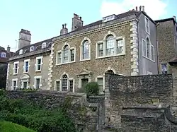 Two-storey houses behind wall