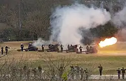 A U.S. Marine Corps artillery battery at the George Bush Presidential Library Center at Texas A&M University fires a 21 gun salute on December 6, 2018