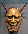 Japanese wooden mask depicting demon.