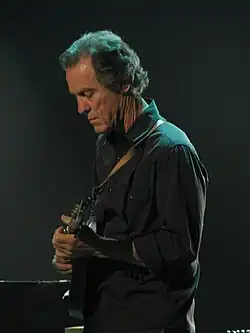 Leisz playing mandolin in Eric Clapton's band in 2013