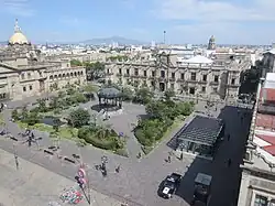 A public square with colonial buildings