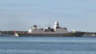 Picture of the side of HNLMS Tromp in 2009, departing Naval Station Norfolk, Norfolk, Virginia, United States.