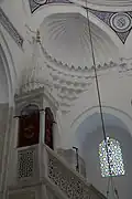 Hadim Ibrahim Mosque view of the top of the minbar, and squinch with muqarnas and perforated lines inlaid