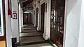 A corridor in the mosque, with the entrance to the prayer hall on the right.