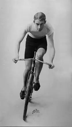 A man on his bicycle headed towards the camera