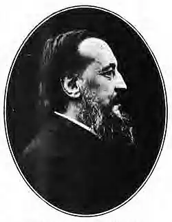 head and shoulders shot of a middle-aged man with a beard looking to the right