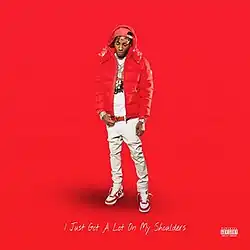 YoungBoy wearing a white outfit and red jacket standing on a red background