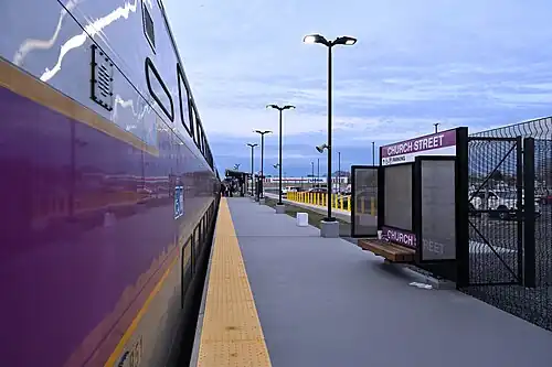 A bilevel train at a train station