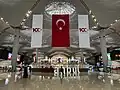 100th-anniversary banners and Turkish flags at Istanbul Airport