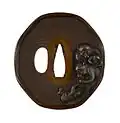 Edo-era tsuba sword guard depicting adult and young monkeys