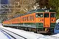 A 115 series EMU between Gokan Station and Kamimoku Station in February 2017