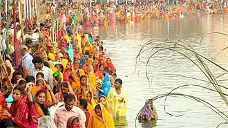 Devotees gathered at a pond to worship the sun god Surya and his sister Chhathi Maiya in Janakpurdham, Madhesh Province, Nepal