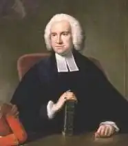 A gentleman in clerical outfit and wig, with his hand on a book