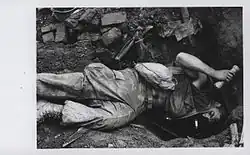 A Marine Tunnel Rat crawls into a captured North Vietnamese bunker