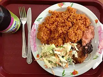 Jollof rice with coleslaw and barbecue chicken