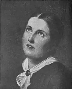 A young white woman, eyes cast upward, hair parted center and dressed back to the nape, wearing a white kerchief fastened with a pin at her throat