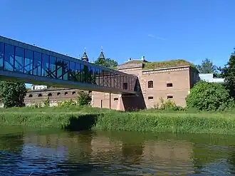 Pedestrian bridge on Cybina river and the Cathedral Lock