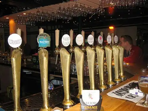 A series of draught beers on tap.