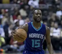 Kemba Walker on the court with a ball in his hands