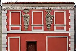 Sculptures of Saints Peter and Paul on the facade of an 18th-century townhouse