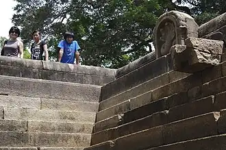 Nāga sculpture and stone spout in north pond[7]