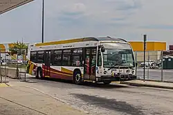 A white, red and orange bus