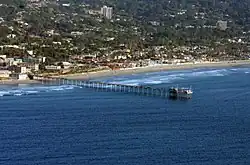 View of La Jolla Shores Beach with Scripps Pier in the background