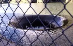 Lake Berryessa overflowing into the glory hole spillway at Monticello Dam