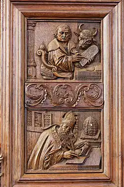 In the top panel Luke the Evangelist writes on a tablet. His attribute the ox looks on. In the lower panel we see Saint Ambrose with a bee-hive. Saint Ambrose is the patron saint of bees and beekeepers