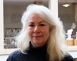 Portrait of Laurel Zuckerman, antique statues in the background