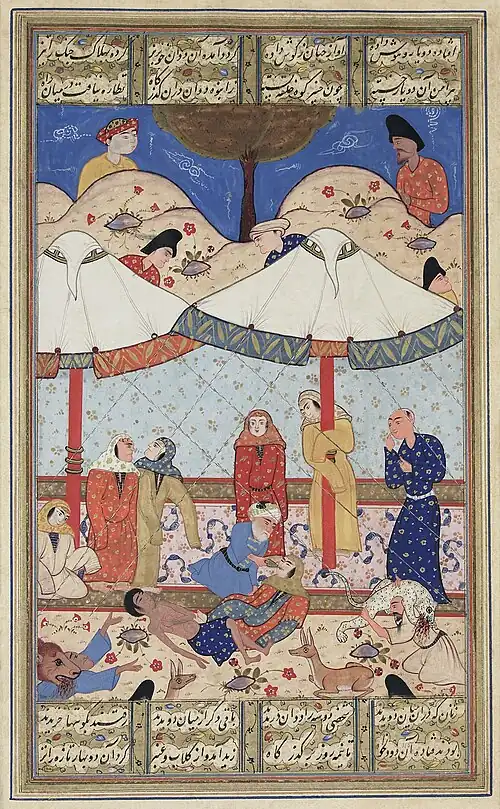 A scene from the romance "Layla and Majnun". The thwarted lovers meet for the last time before their deaths. Both have fainted and Majnun's elderly messenger attempts to revive Layla while wild animals protect the pair from unwelcome intruders. Late 16th-century illustration.