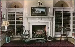 Wall with built-in bookshelves and fireplace