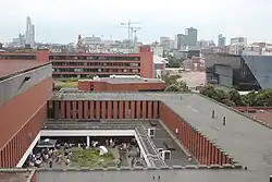 Looking North over the Kilburn Building towards the City from University Place, with Manchester One and