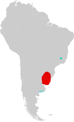 Map of South America marked by red and blue colors, with the red color extending over Uruguay and into Rio Grande do Sul, southern Brazil, and the blue color in southeastern Minas Gerais, eastern Brazil, and in two different areas in northern and southern Buenos Aires Province, eastern Argentina