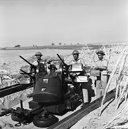 Pakistani soldiers operating an M45 quad mount during the 1965 conflict with India