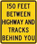 W10-11b XX feet between highway and tracks behind you
