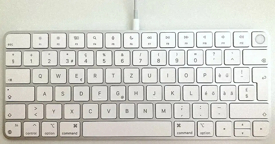 Photo of a Magic Keyboard with Touch ID, swiss keyboard layout, with the Lightning cable connected