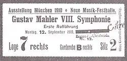 A rectangular card, the main text of which reads "Ausstellung München 1910. Neue Musik-Festhalle. Gustav Mahler VIII. Symphonie, Erste Aufführung, Montag 12. September 1910."