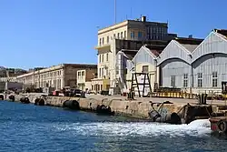 Early 20th-century machine shop (left) and boat sheds (right) alongside No. 7 dock and the adjacent wharf.