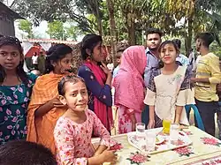 Attendees at a rural marriage ceremony in Mymensingh, Bangladesh