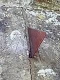Sundial with a triangular gnomon at St George's in Damerham, Hampshire, England
