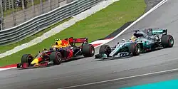 Verstappen overtaking Lewis Hamilton for the lead of the 2017 Malaysian Grand Prix