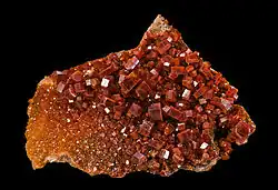A cluster of Milbaden vanadinite crystals, showing their hexagonal shape