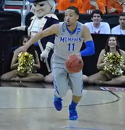 Michael Dixon is dribbling the ball for the Memphis Tigers at the NCAA Tournament in Raleigh