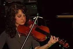Posen playing violin