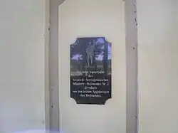 Memorial plaque on the left