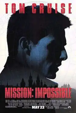 The profile view of Tom Cruise's Ethan Hunt, in a navy blue hue, is superimposed on top of a black silhouette of Kyiv with a white background.